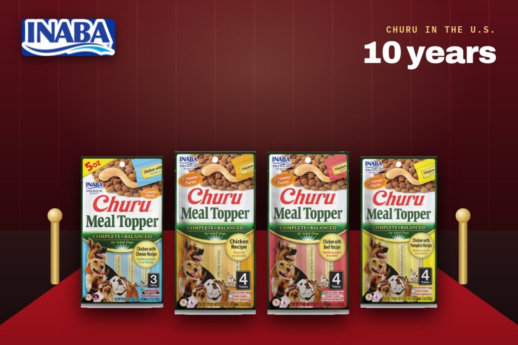 INABA logo and four Churu Meal Topper packs for dogs on a red carpet, marking 10 years of Churu in the U.S.